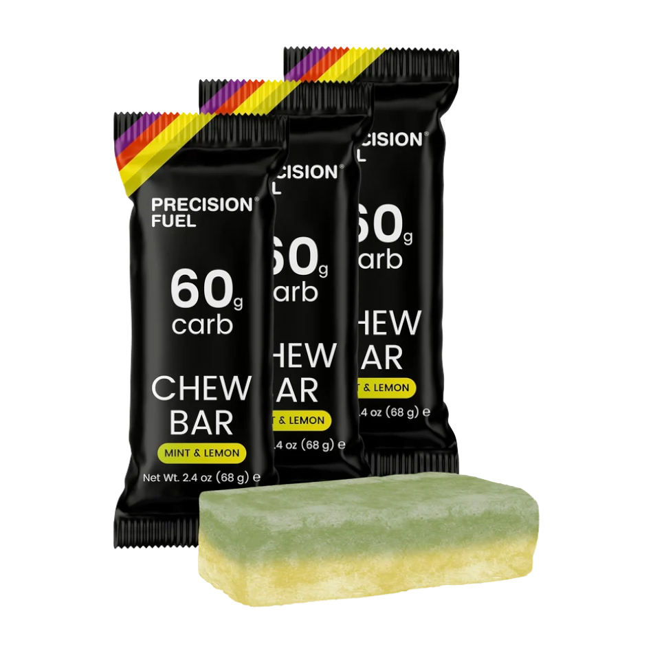 Up & Running Precision Fuel 60 Chew Bar in Mint and Lemon flavour with black packaging and a layered energy bar.