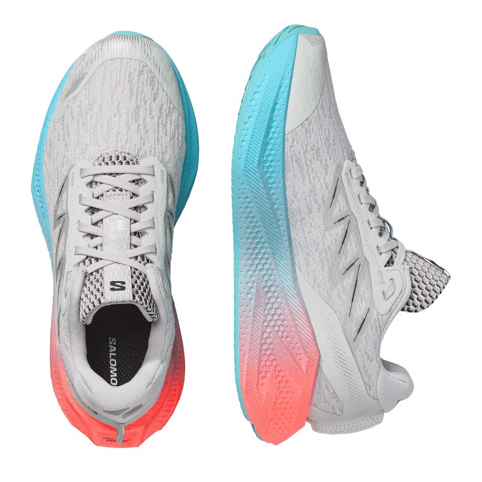 Up & Running Salomon Women's Aero Glide 4 running shoes in grey violet, blue, and coral with high-stack foam cushioning.