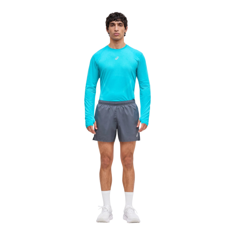 Up & Running model wearing ASICS Men's Core 5 inch running shorts in carrier grey with reflective logo detail