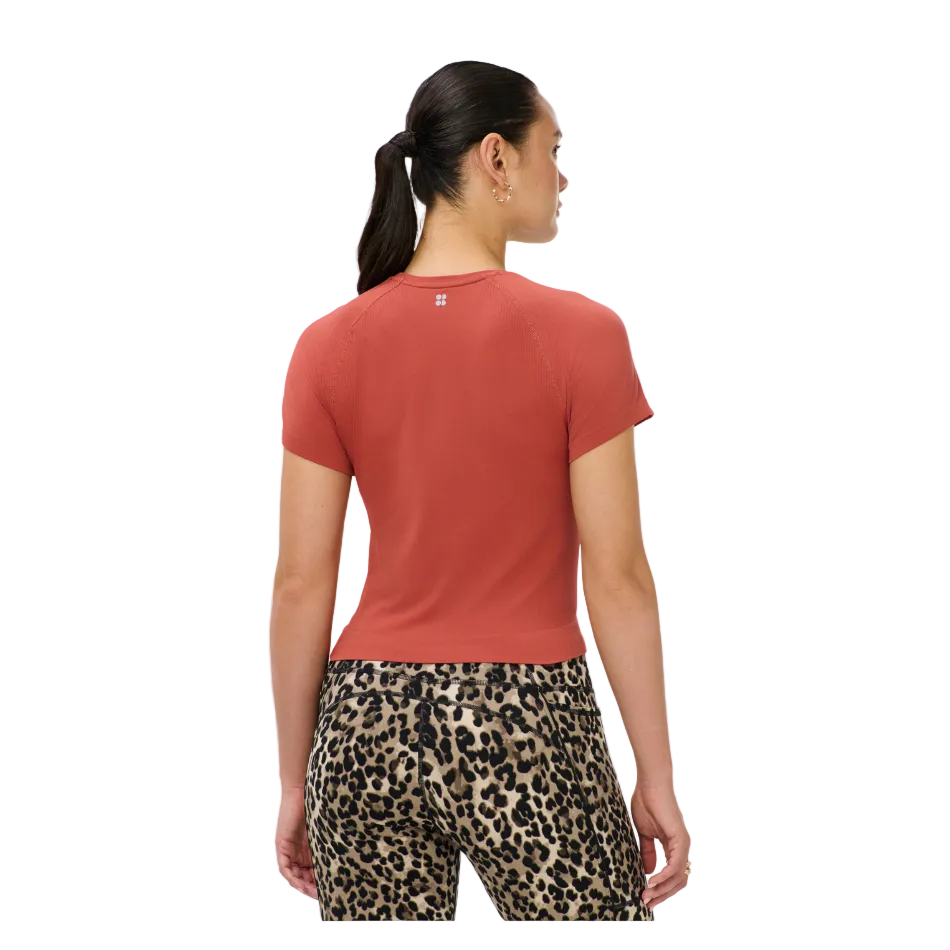 Athlete Crop Seamless Workout T-Shirt in Terazzo Red, model back view