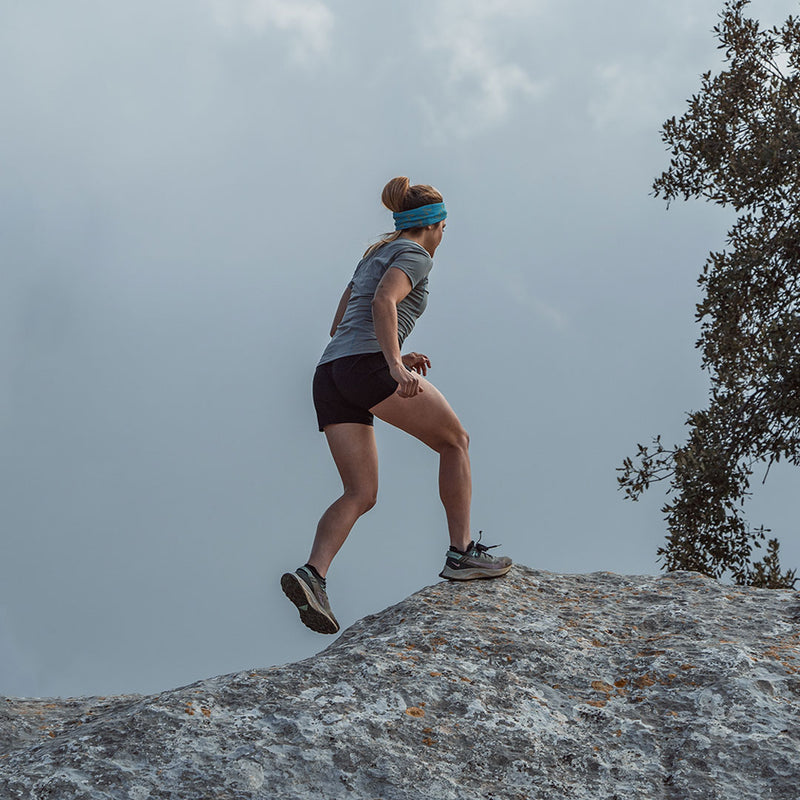 Woman running up mountain