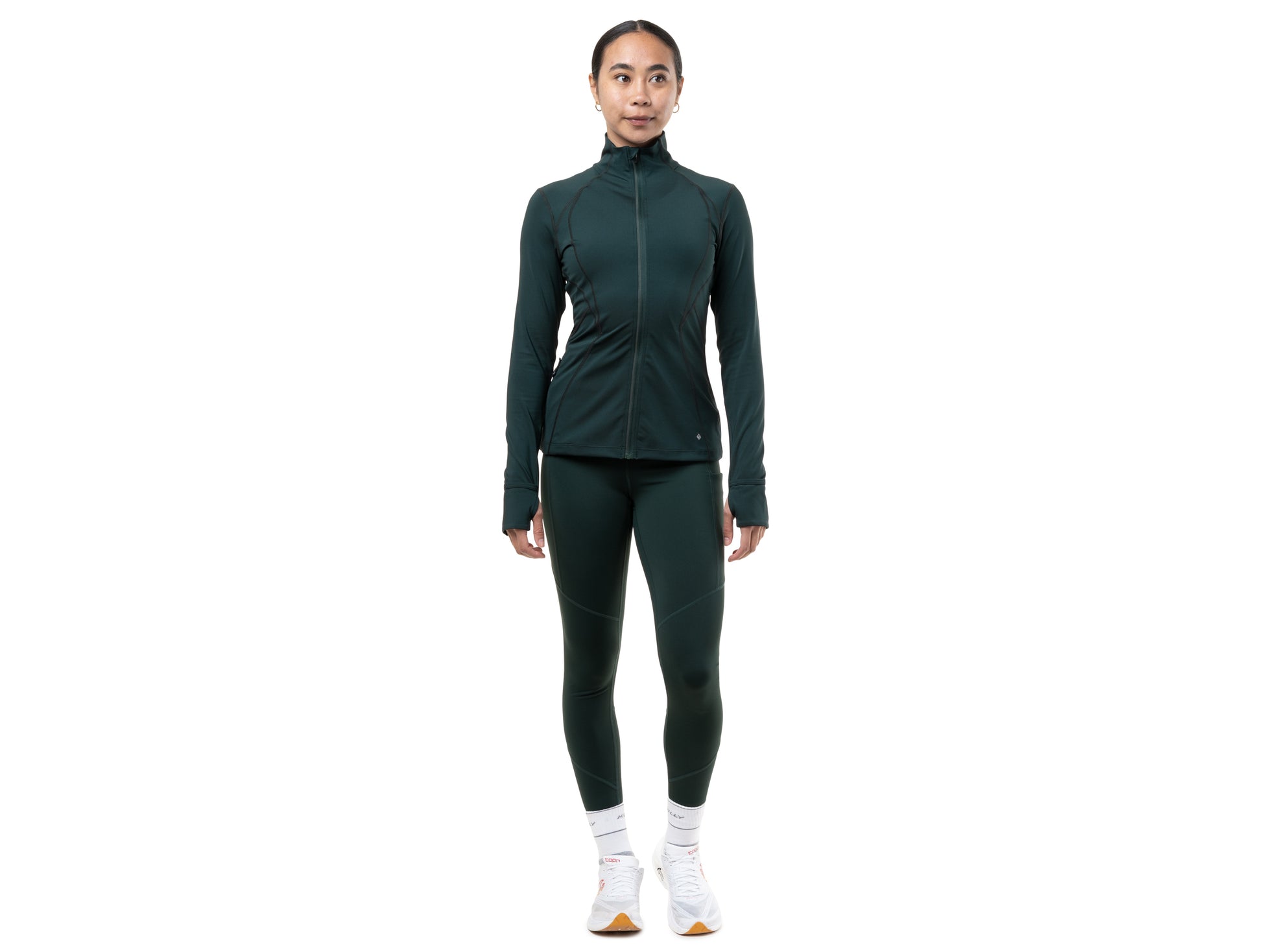Person wearing a green athletic outfit on a white background