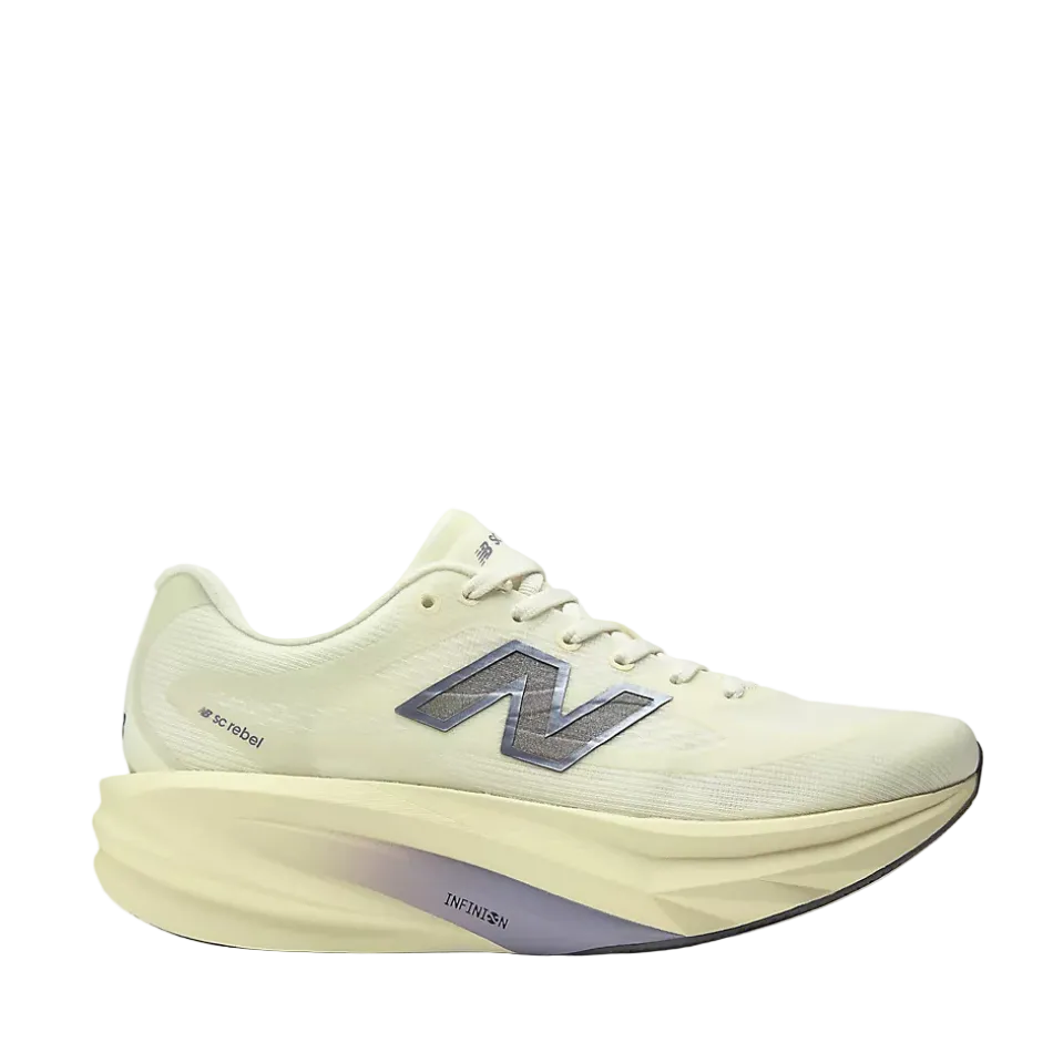 A New Balance running shoe in a light pistachio green, featuring a thick sculpted foam midsole and a metallic silver 'N' logo on the side.