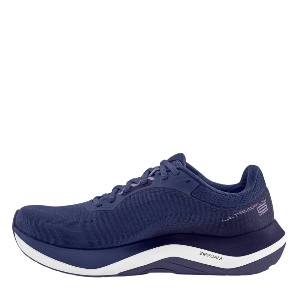 Up & Running Topo Women's Ultrafly 6 running shoes in purple and white with ZipFoam midsole and supportive design.