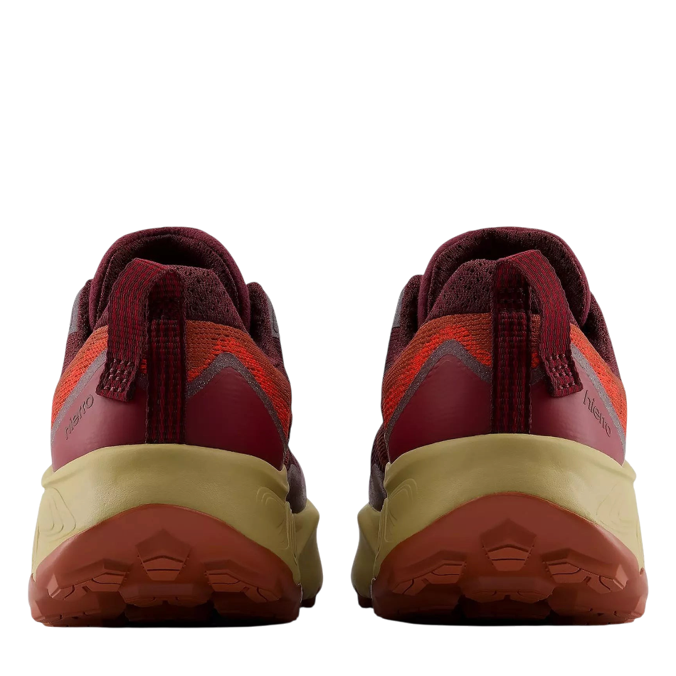 Rear view of Up & Running New Balance Women's Hierro v9 trail running shoes in mulled wine with Vibram lugged outsoles.