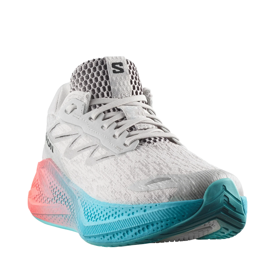 Up & Running Salomon Women's Aero Glide 4 running shoes in grey, blue, and coral with high-stack foam cushioning.