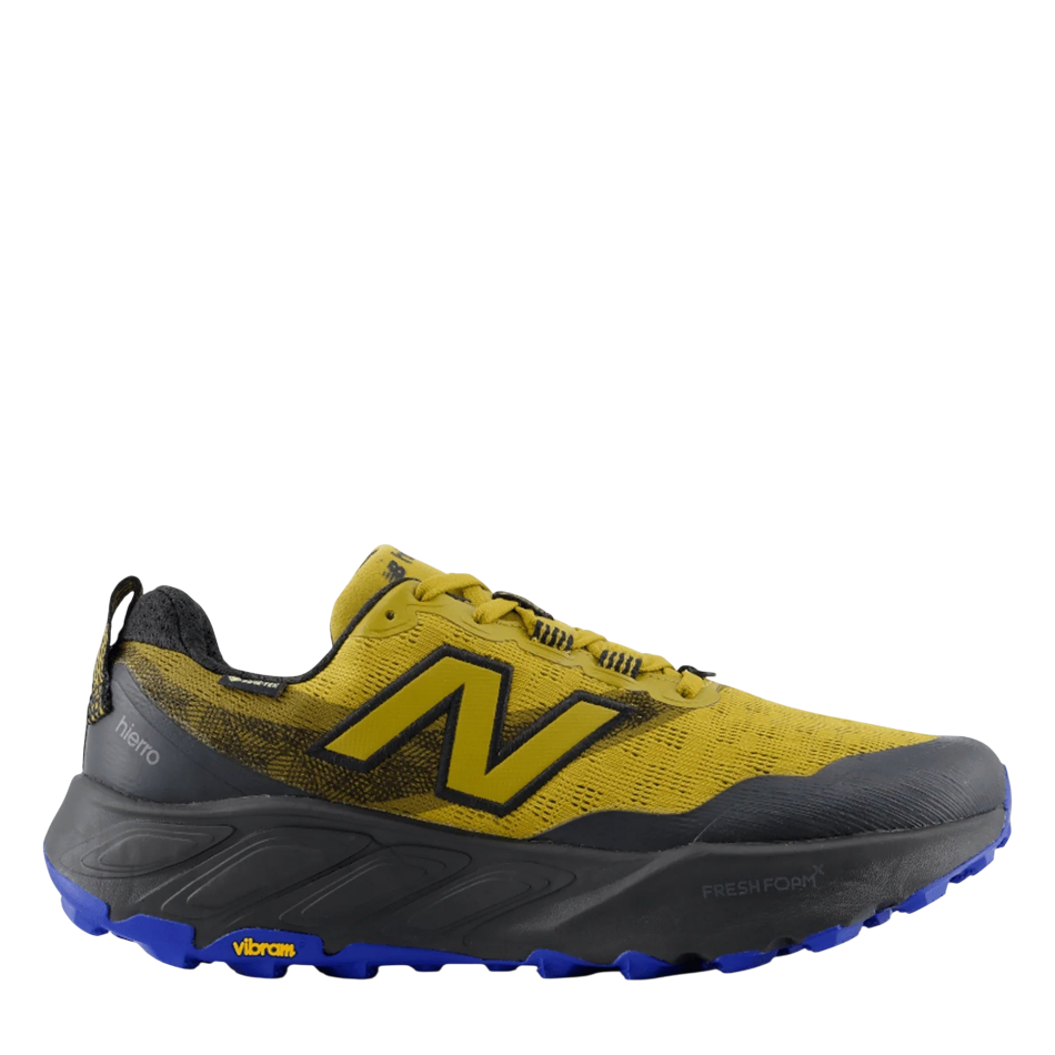 Up & Running New Balance Hierro v9 GORE-TEX trail running shoe in basil oil and black with a blue Vibram outsole.