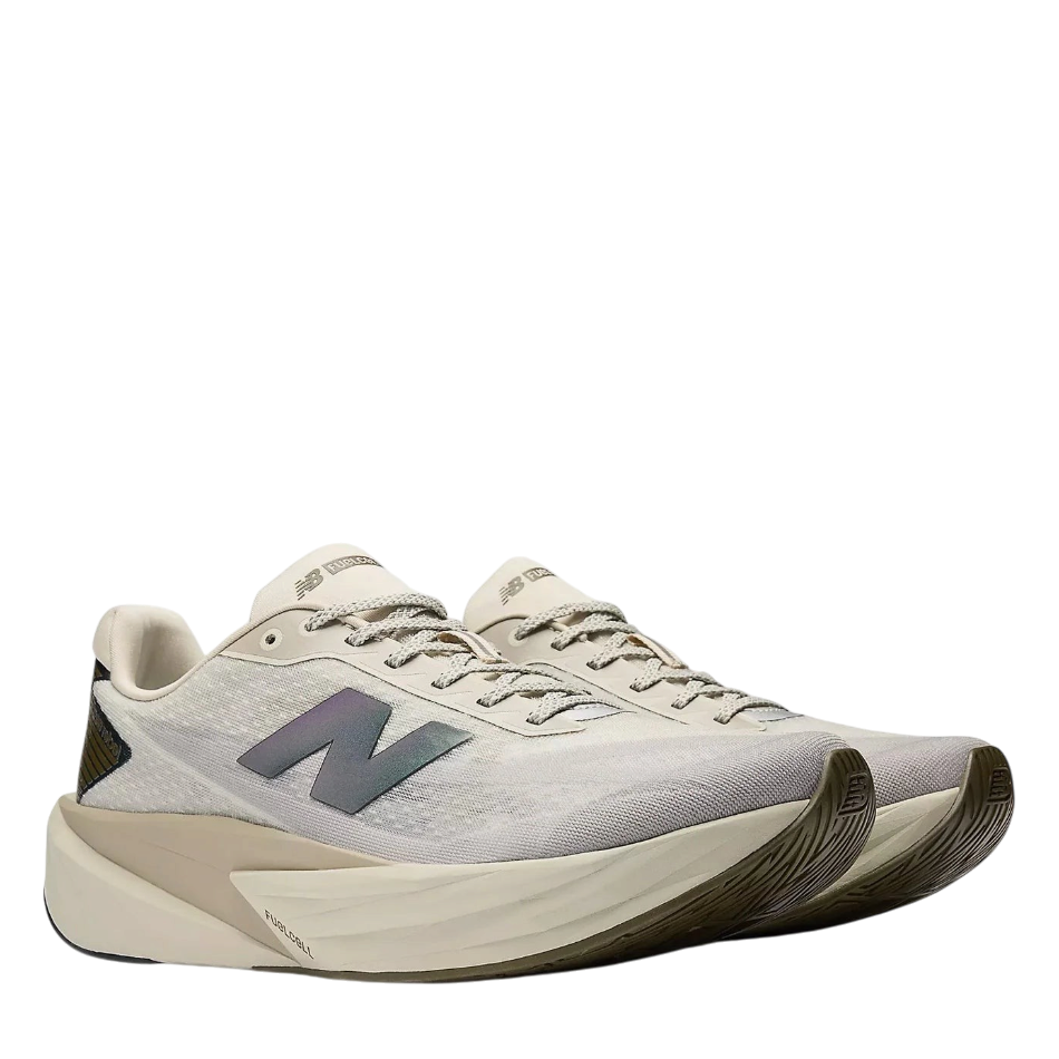 Up & Running New Balance Fuelcell Rebel v5 running shoes in shipyard and arid stone with metallic silver accents.
