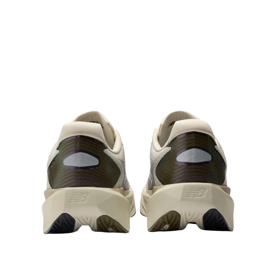 Up & Running New Balance Fuelcell Rebel v5 running shoes in shipyard and arid stone, rear view showing heel design