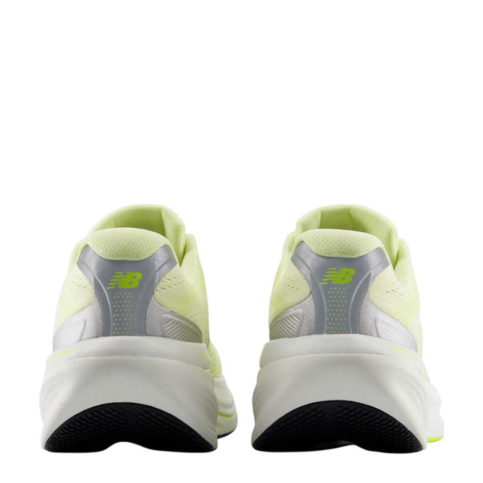 Up & Running New Balance 860 v15 running shoes in fennel seed yellow, showing the rear heel view with stability base.